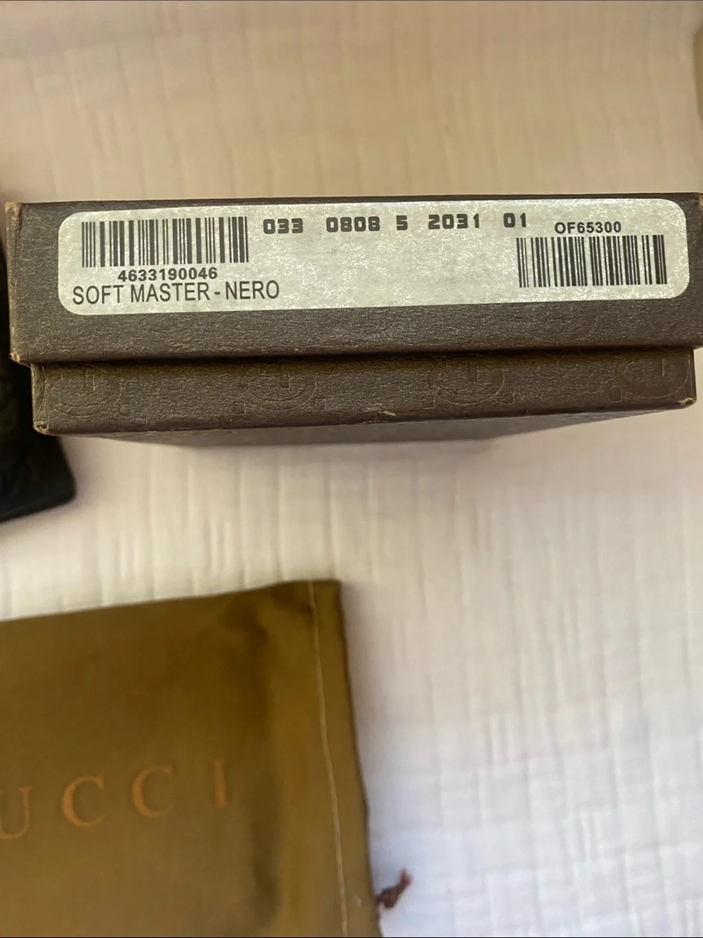 Gucci Dark Brown GG Embossed Leather Bi-Fold Wallet